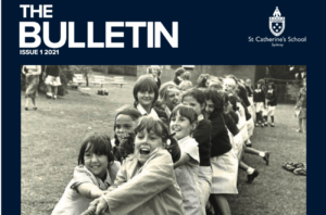 Cover of St Catherine's "The Bulletin" featuring a black and white photo of young girls playing tug of war.